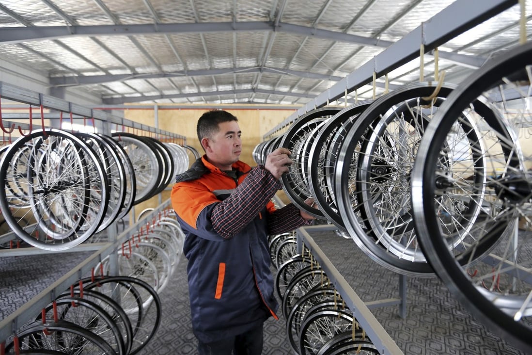 An electric bicycle factory in China’s central Anhui province. Chinese manufacturers are shipping their bicycles to Thailand for relabelling in a bid to dodge European Union tariffs. Photo: AP