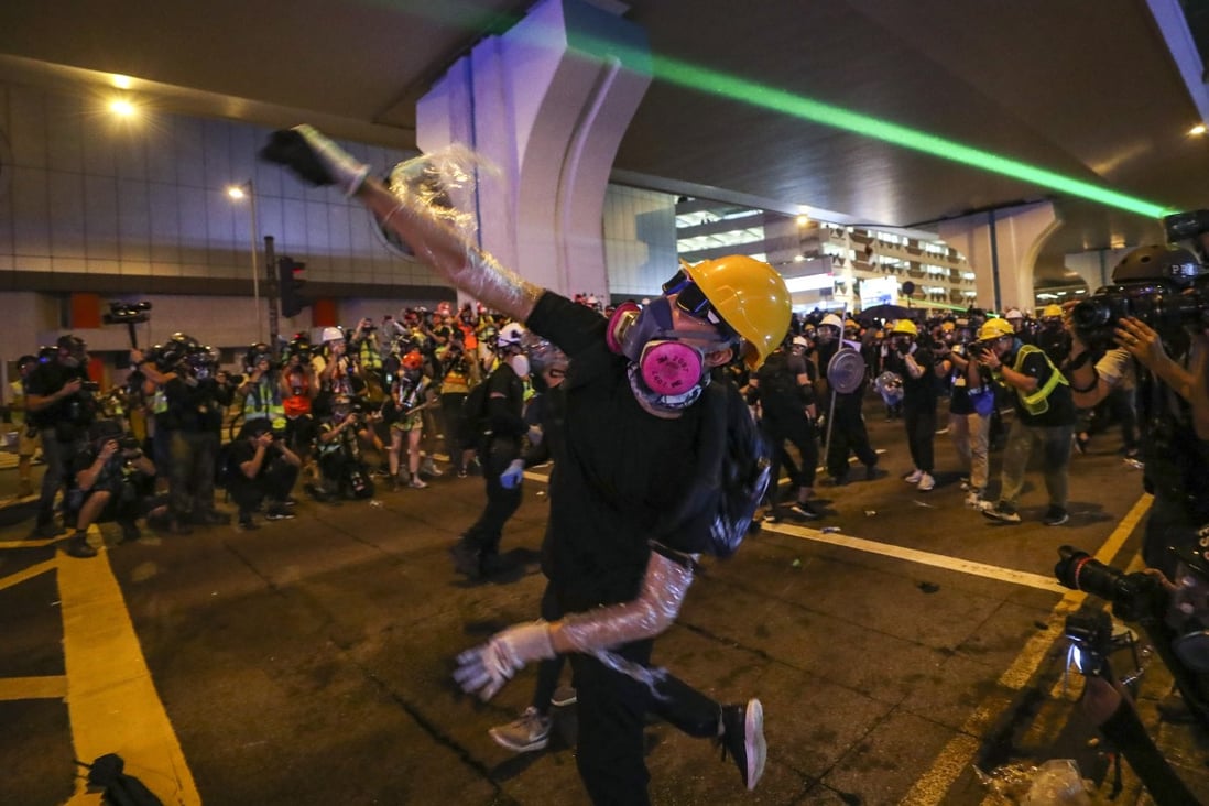 Protesters clash with riot police as they retreat to Connaught Road in Central after rallying outside the central government’s liaison office in Sai Ying Pun. Photo: Sam Tsang