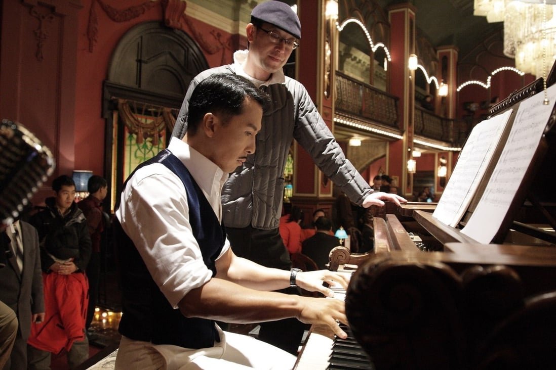 Donnie Yen playing the piano in Legend of the Fist: The Return of Chen Zhen (2010), directed by Andrew Lau (back).