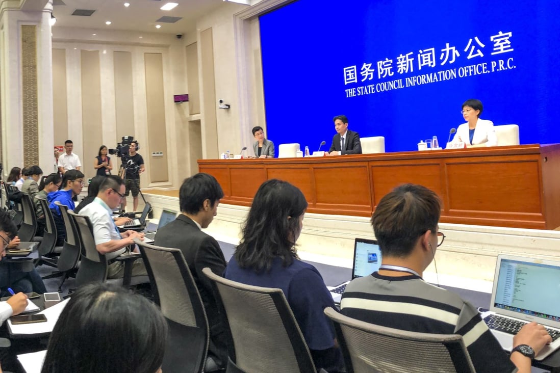 Yang Guang and Xu Luying, from the Hong Kong and Macau Affairs Office, give a press briefing in Beijing on the situation in Hong Kong on Monday. Photo: Simon Song