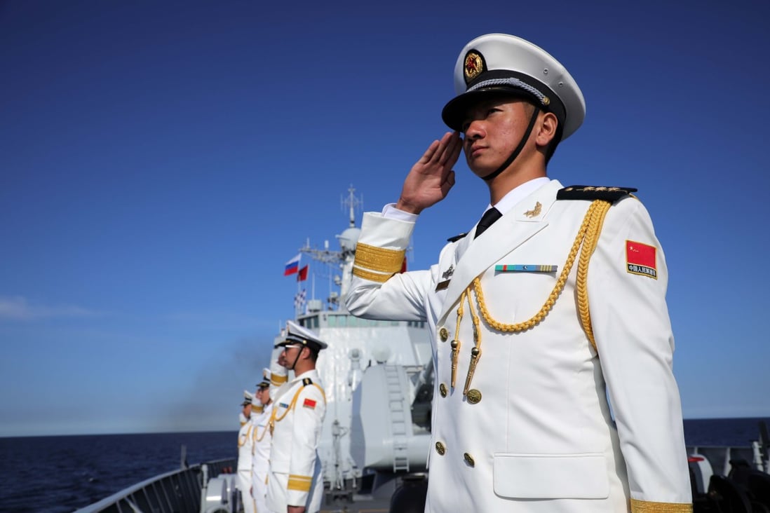 Chinese sailors line up on the deck of the Xian guided-missile destroyer during Russia’s Navy Day parade near St Petersburg on Sunday. Photo: Xinhua