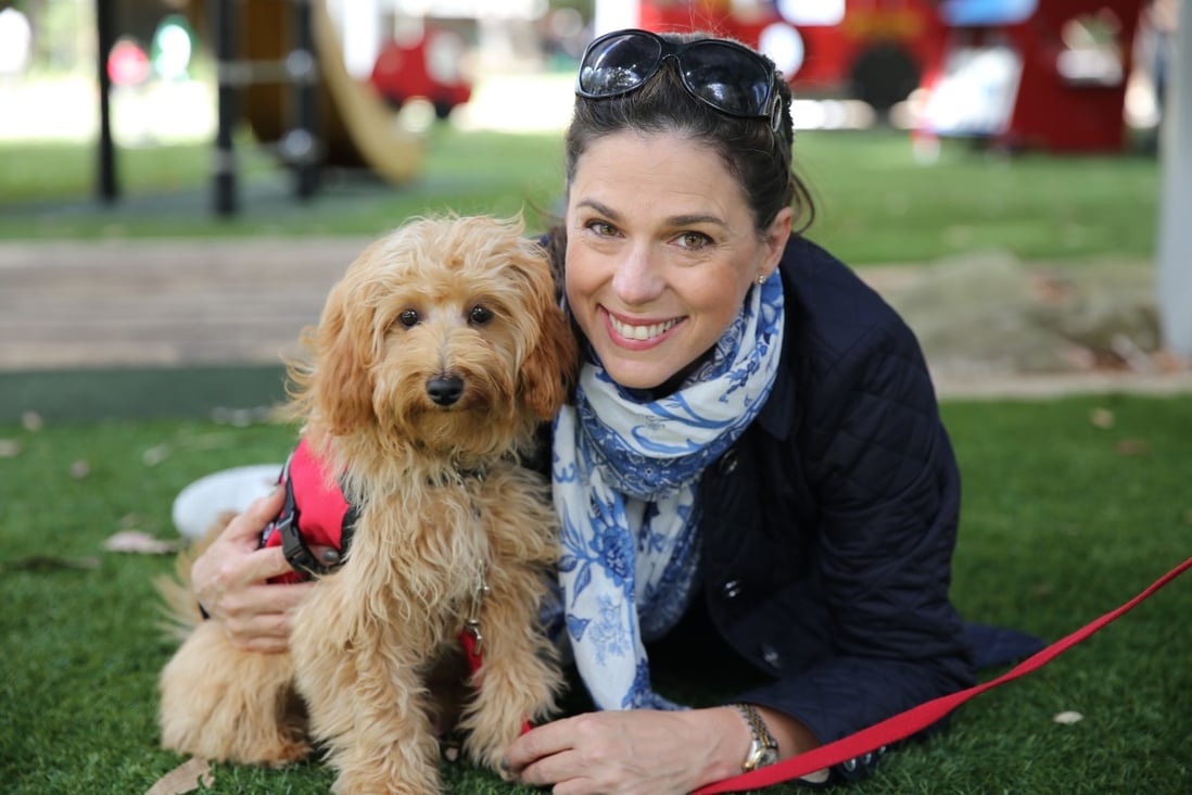 If you want to live the best life you can, Justine Campbell (above, with her therapy dog, Mintie) recommends having self-compassion, and acknowledging your problems, but not dwelling on them.