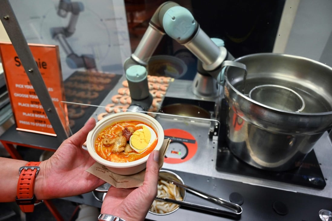 Sophie the robotic chef can serve up a piping hot bowl of laksa in under a minute. Photo: AFP