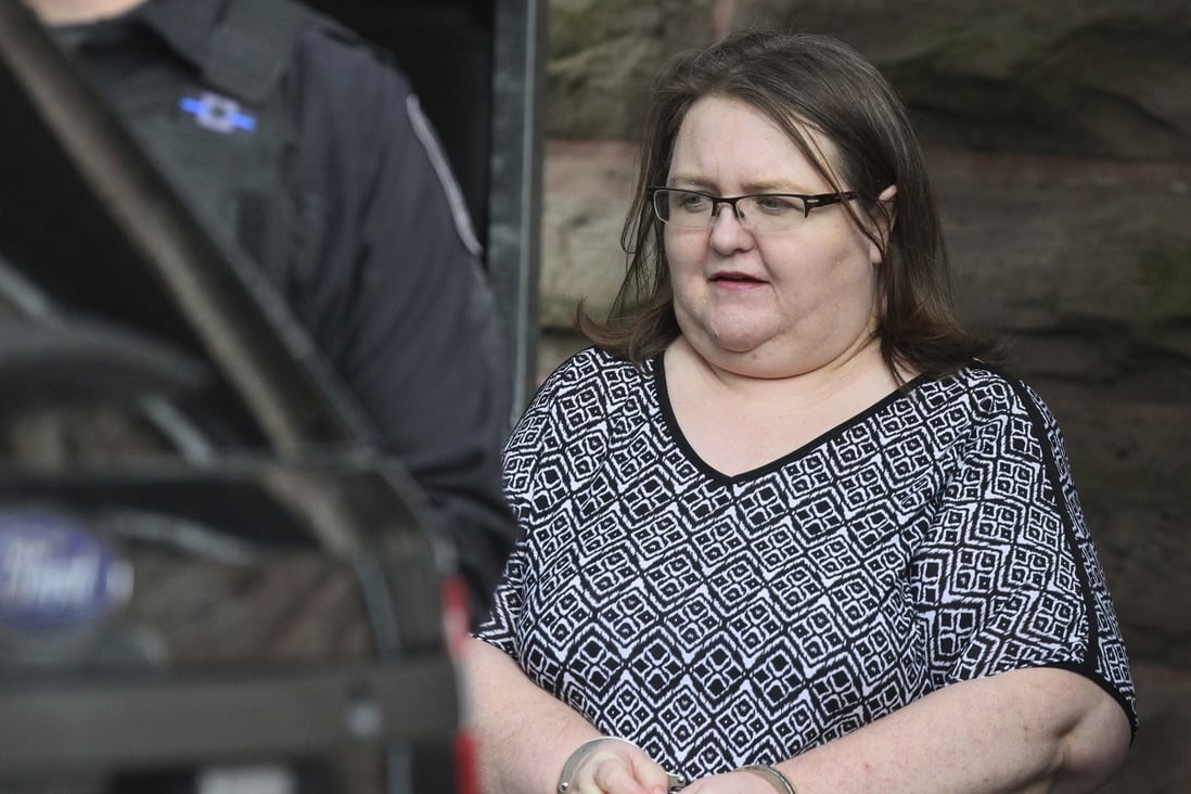 Elizabeth Wettlaufer is escorted by police from the courthouse in Woodstock, Ontario, in June 2017. Photo: The Canadian Press via AP