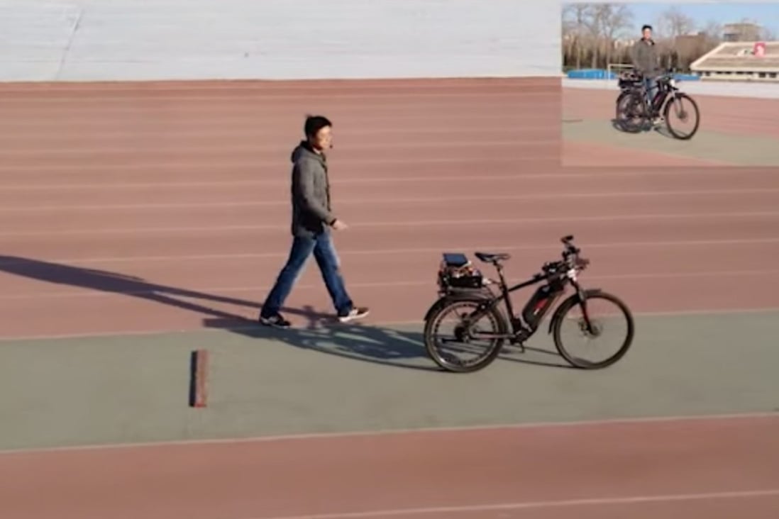 A screenshot from the video of an autonomous bicycle – equipped with a camera, gyroscope, speedometer, driving and steering motors, and a Tianjic chip – put on a road test by Chinese researchers, led by Tsinghua University professor Shi Luping, to demonstrate so-called artificial general intelligence. Photo: Handout