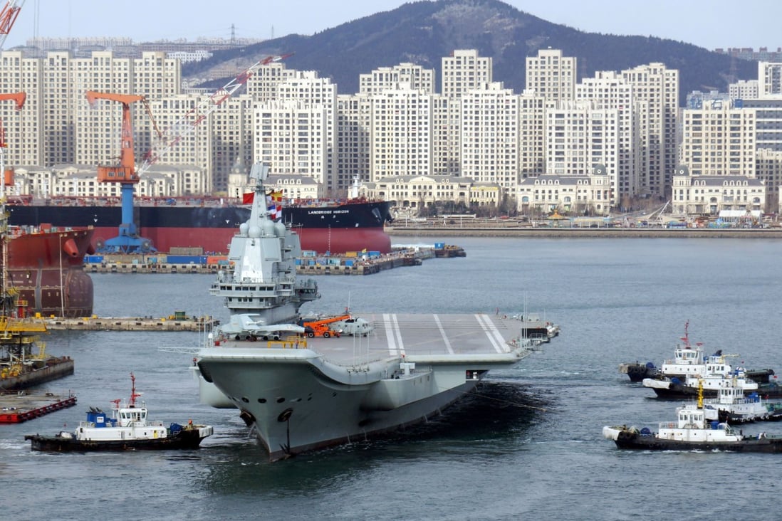 The carrier leaves the port of Dalian for a sea trial in December. Photo: Reuters