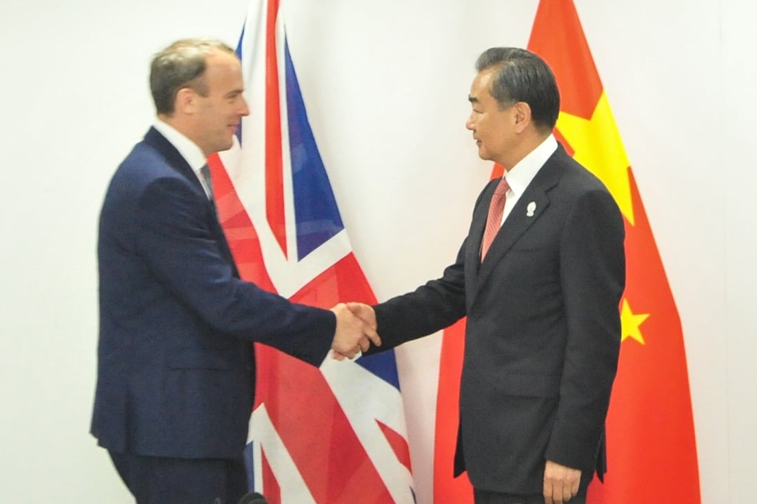 British Foreign Secretary Dominic Raab and Chinese Foreign Minister Wang Yi in Bangkok, Thailand, at the Asean meeting. Photo: Xinhua