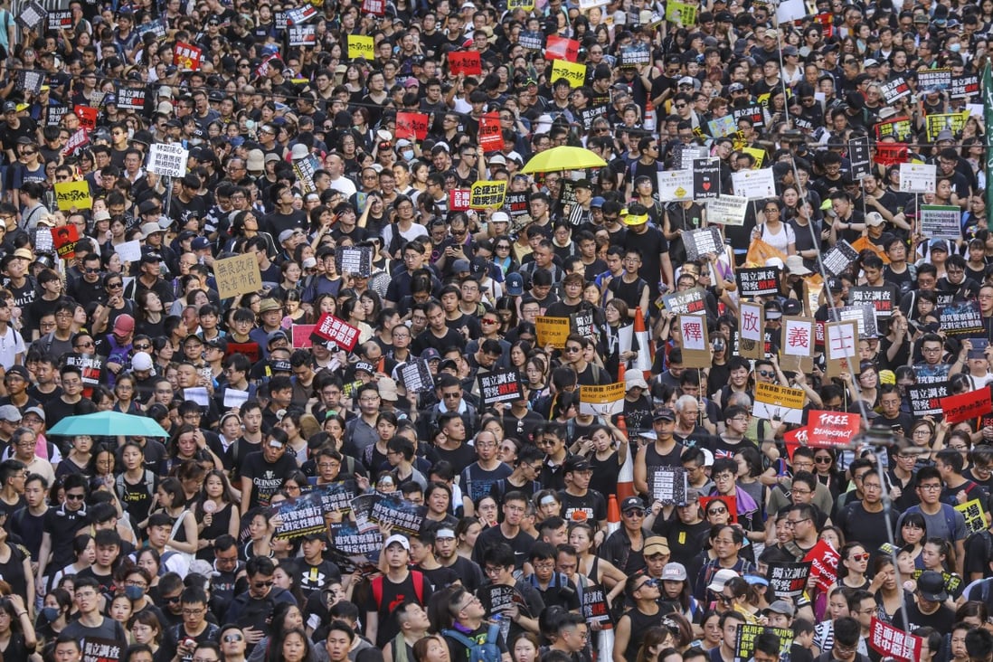 Protesters march from Victoria Park in Causeway Bay to the Central Government Offices in Tamar against the extradition bill on July 1, 2019. Photo: Felix Wong