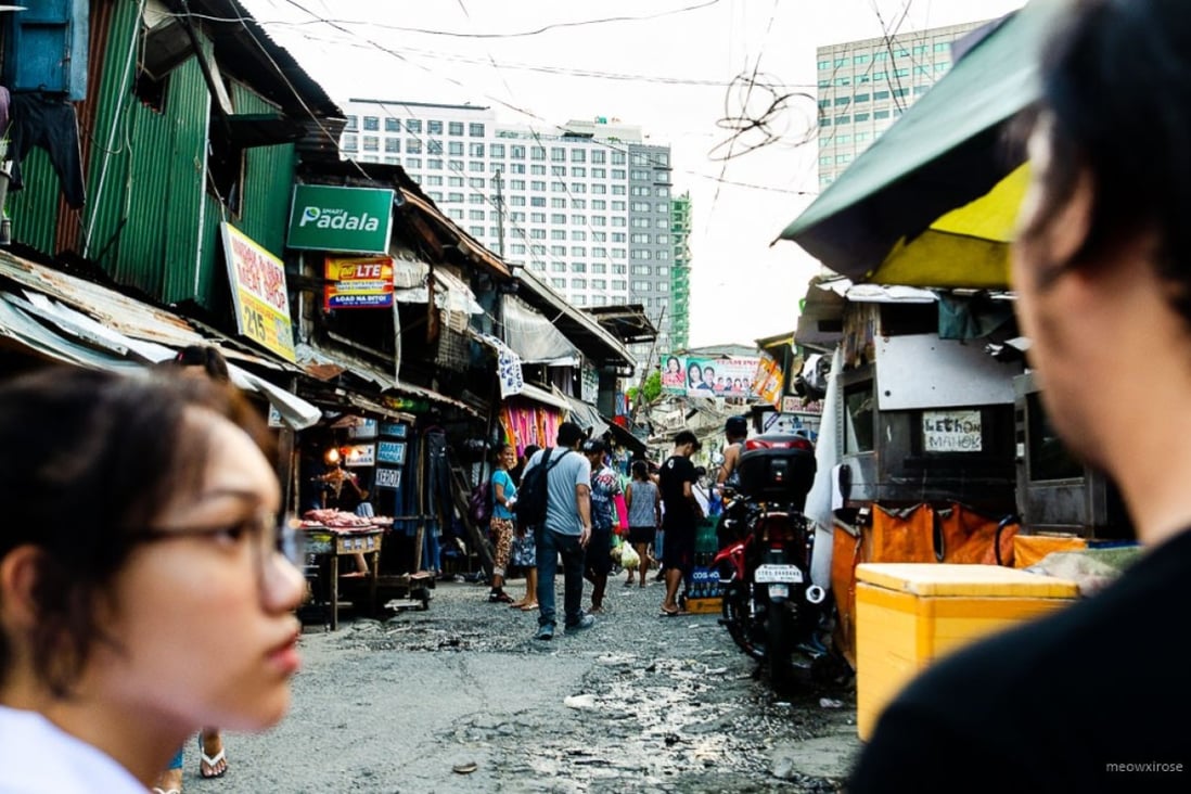 Stalls that sell everything from bread to children’s toys pepper the narrow streets of San Roque in Metro Manila in the Philippines. The neighbourhood is under threat of demolition to make way for a commercial development. Photo: Maro Enriquez