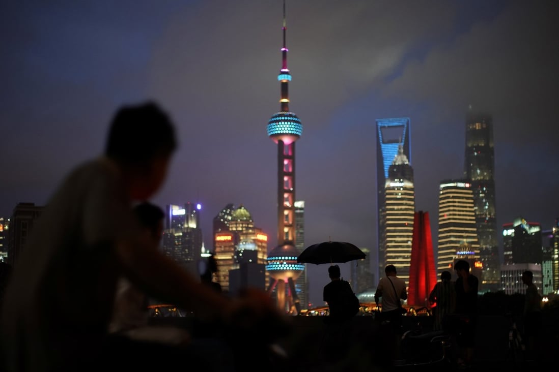 Pedestrians look at the Shanghai skyline on July 19. International talent, including international students, have become a key ingredient for China’s high-quality growth. Photo: Reuters