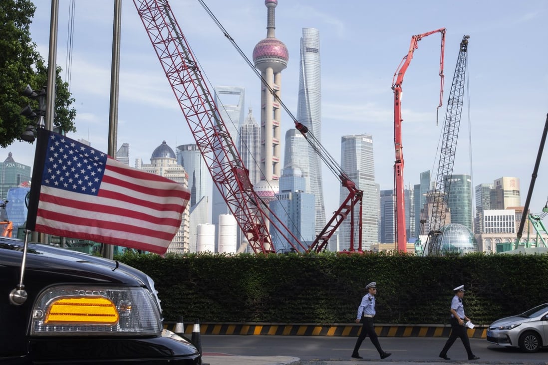 Chinese traffic police walk past a US embassy car parked outside a hotel in Shanghai on July 30, when negotiators from both sides were holding trade talks. Just days later, US President Donald Trump announced new 10 per cent tariffs on US$300 billion worth of Chinese goods, starting in September. Photo: AP