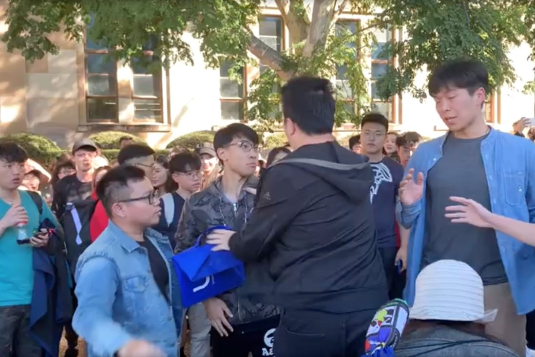 Hong Kong and mainland Chinese students clash during a protest at the University of Queensland on Wednesday. Photo: Twitter