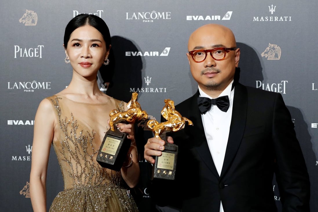 Actors Hsieh Ying-xuan and Xu Zheng pose after winning top honours at the Golden Horse awards in 2018. Xu, from mainland China, won the award for his role in the box-office hit Dying to Survive. Photo: Reuters