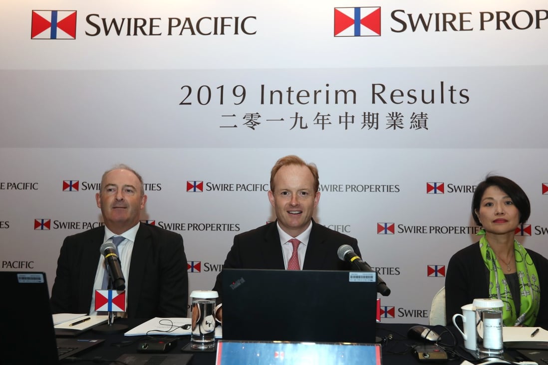 (From left) Swire Pacific CEO Guy Bradley, chairman Merlin Swire and finance director Michelle Low Mei-shuen, at a press conference to announce the company’s first-half results. Photo: Xiaomei Chen