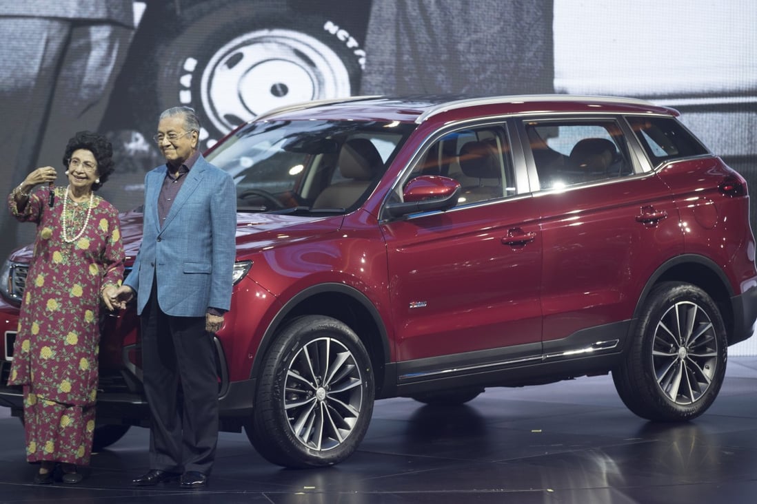 Malaysian Prime Minister Mahathir Mohamad with his wife during the launch of Proton’s new SUV in 2018. Photo: AP