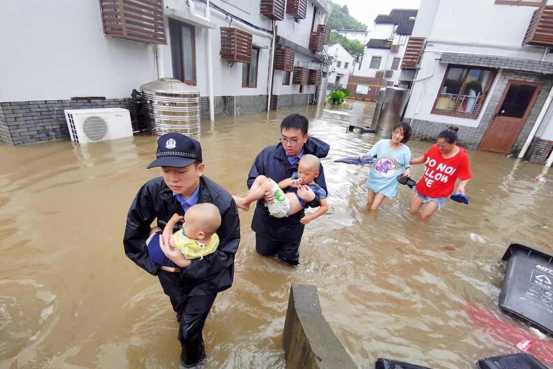 Policemen helping people stranded by floods in Zhoushan City, a part of China’s Zhejiang Province, on Saturday. Typhoon Lekima, the ninth of the year, made landfall in Wenling City. Photo: Xinhua