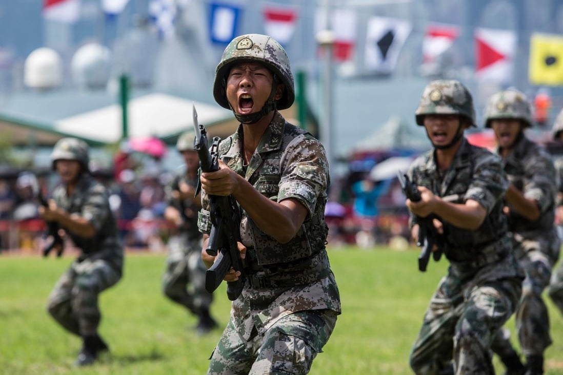 Chinese soldiers take part in a drill open to the public at the Stonecutters Island naval base in Hong Kong on June 30, to mark the 22nd anniversary of the handover of Hong Kong. Photo: AFP