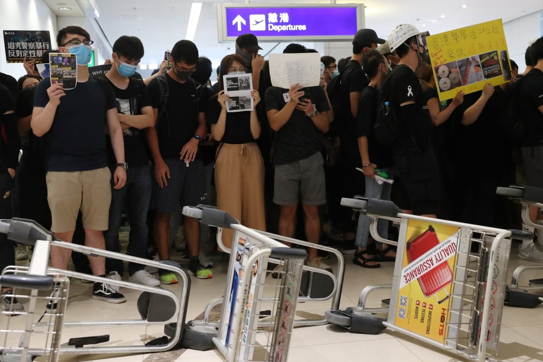 Anti-government protesters at Hong Kong International Airport paralysed one of the world’s busiest aviation hubs for a second consecutive day on Tuesday. Photo: Sam Tsang
