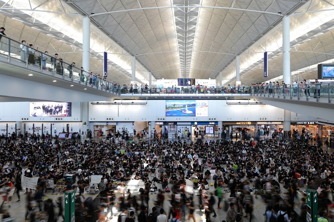 Protesters stage a sit-in at Hong Kong International Airport on Tuesday. Photo: Sam Tsang