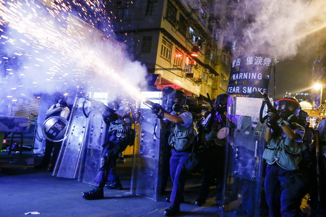 Police fire tear gas at pro-democracy protesters during clashes in Sham Shui Po in Hong Kong on Wednesday. Photo: Reuters