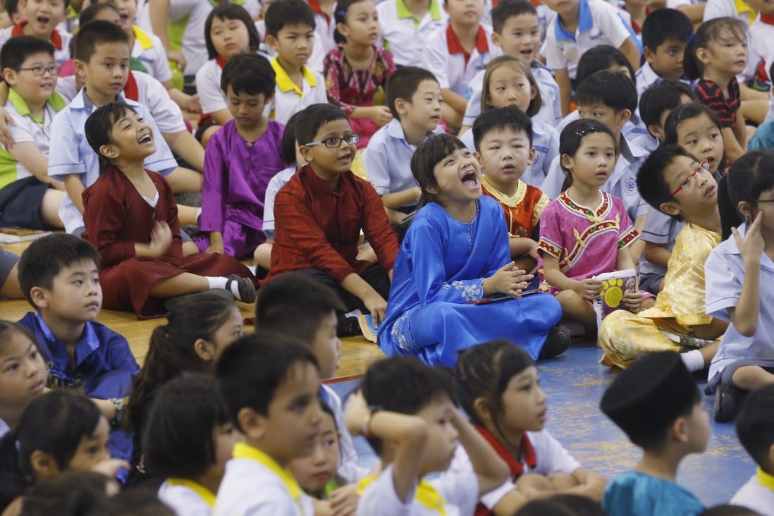 School pupils in Singapore wear traditional costumes on Racial Harmony Day. Photo: Kevin Lim