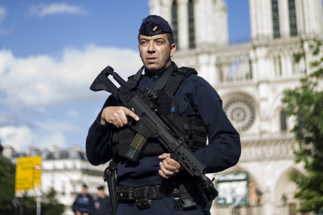 A French police officer stands guard outside the Notre Dame cathedral. File photo: EPA