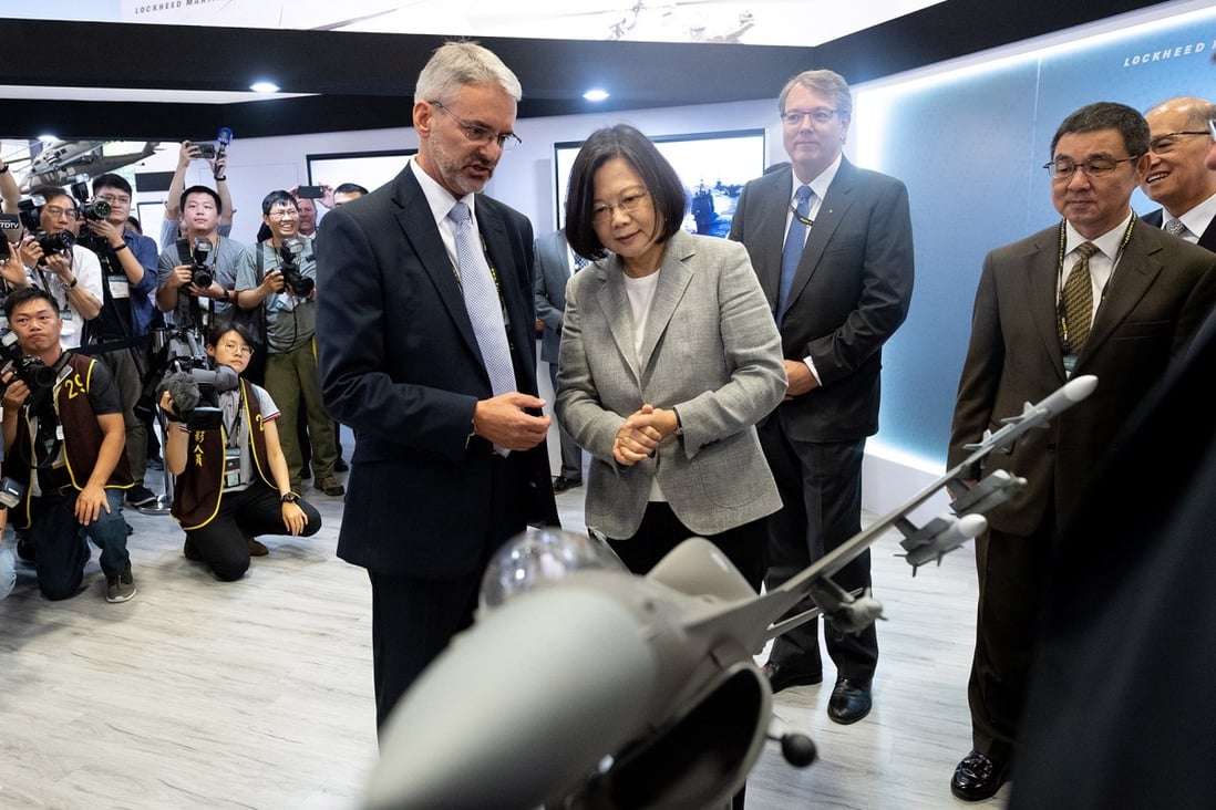 Taiwanese President Tsai Ing-wen (centre) looks at a US F-16 jet model at the Taipei Aerospace and Defence Technology Exhibition in Taipei on August 15. The US is selling US$8 billion worth of the fighter aircraft to Taiwan. Photo: EPA-EFE