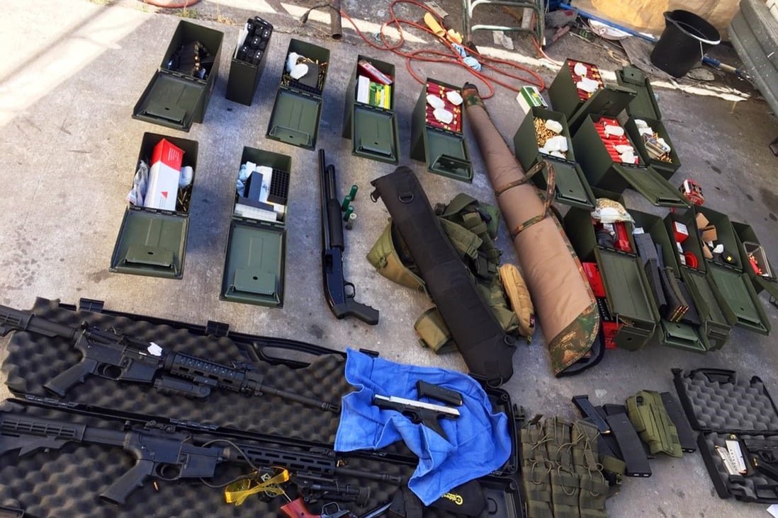 This undated photo released by the Long Beach Police Department shows weapons and ammunition seized from a cook at a southern California hotel who allegedly threatened a mass shooting. Photo: AP