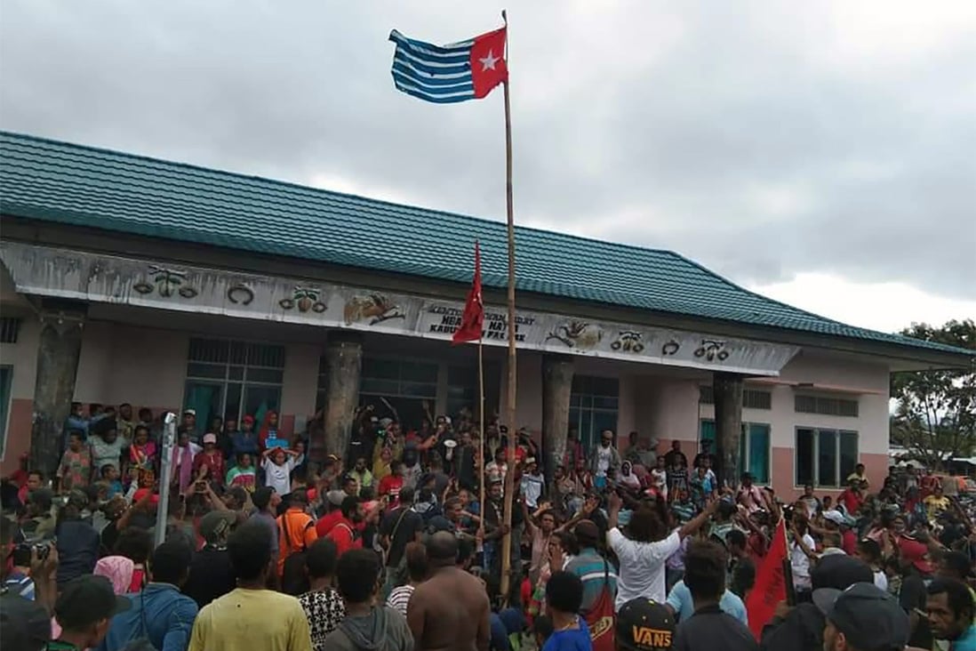 Protesters gather under the banned West Papuan flag in the city of Fakfak. Photo: AFP