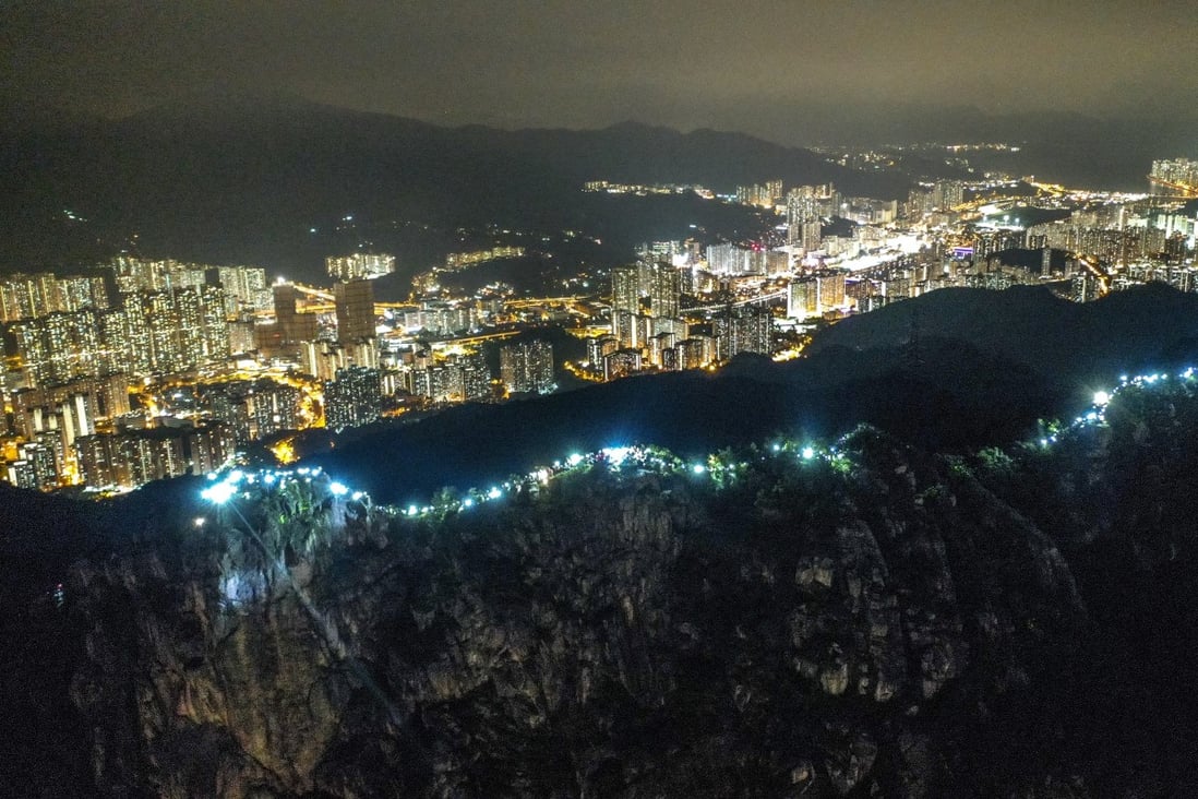 The slopes of Lion Rock were lit up on Friday with flashlights and laser pointers. Photo: Winson Wong