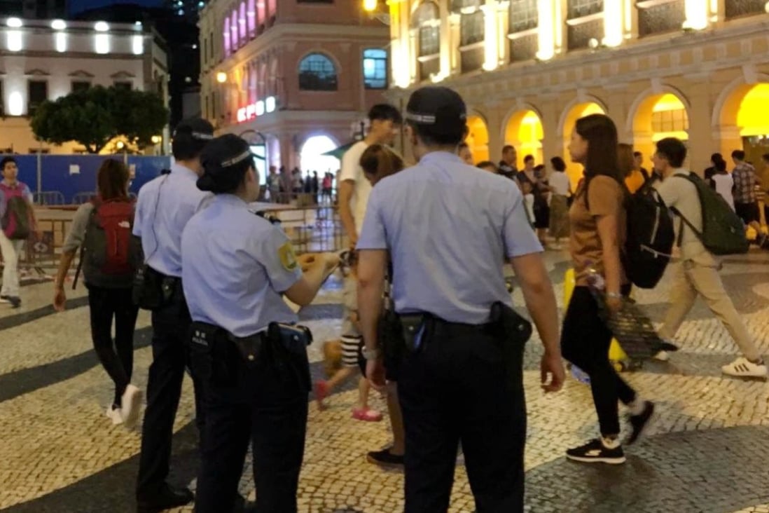 Police officers are seen at Senado Square, Macau. Photo: Facebook / All About Macau