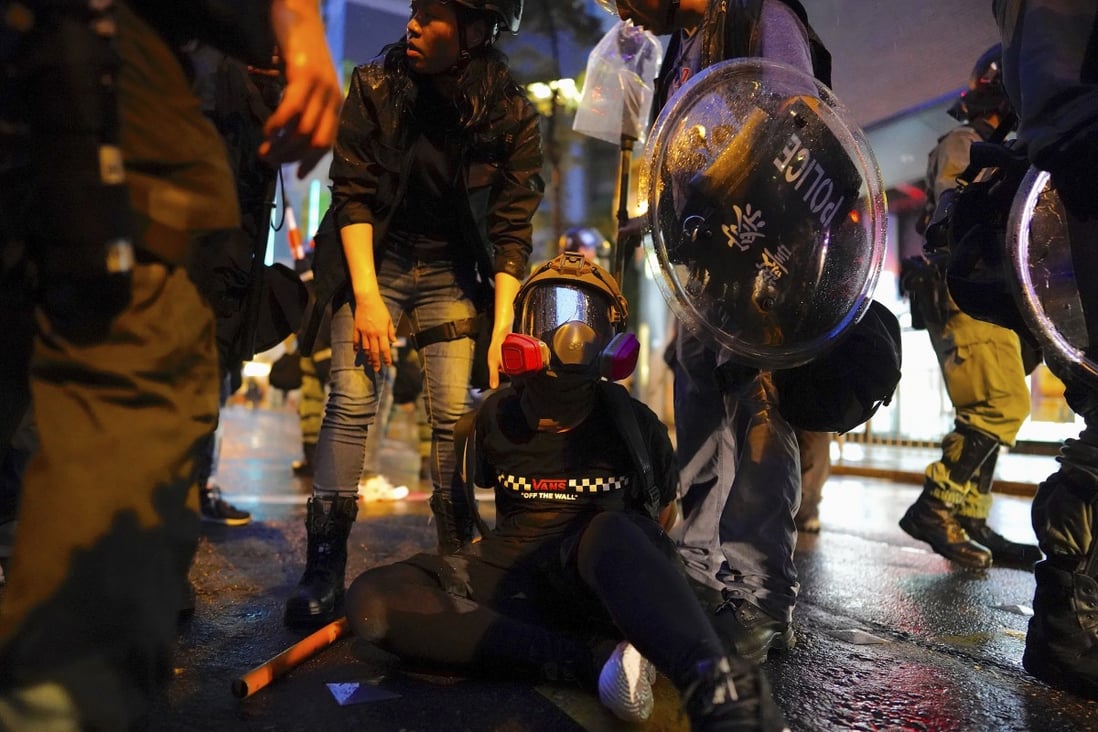 Police arrest a demonstrator during a protest on August 25 in Tsuen Wan. Photo: AP