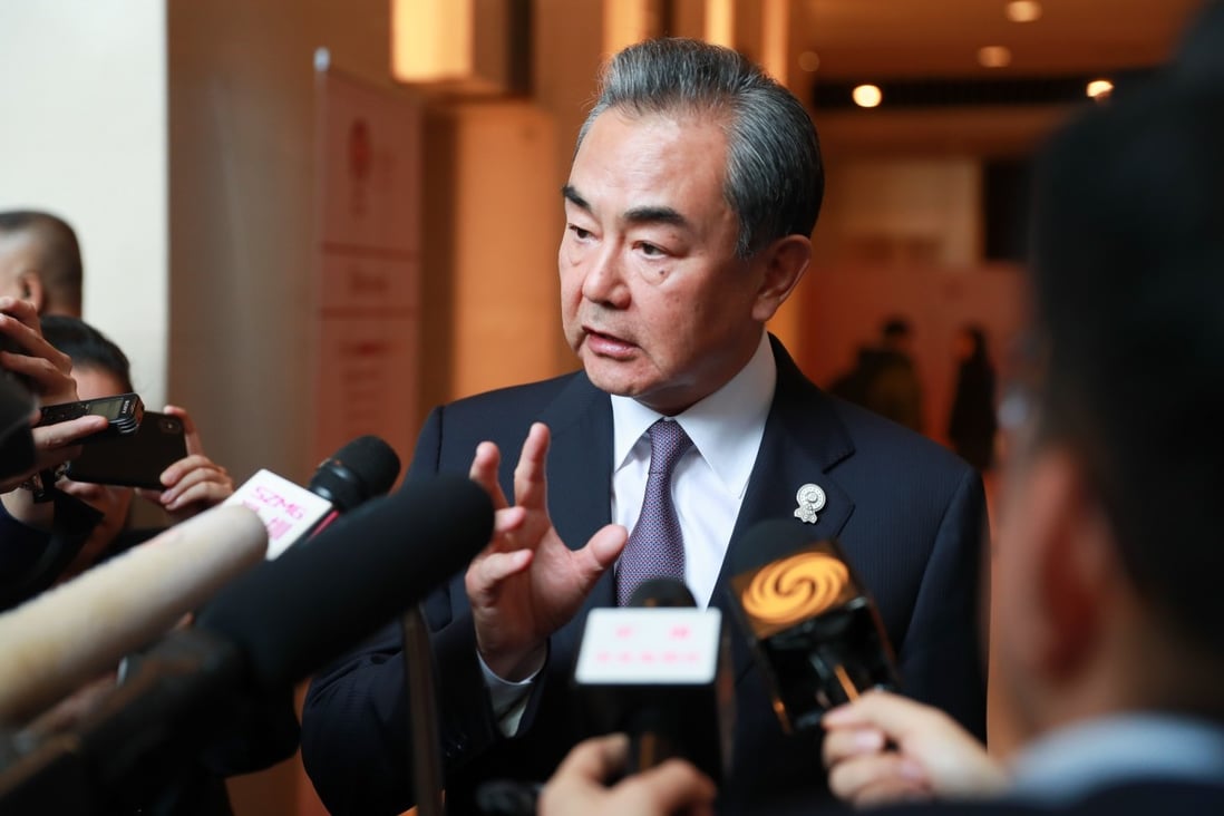Chinese Foreign Minister Wang Yi calls on Hong Kong business leaders to become a unifying force as protests triggered by an extradition law enter their 12th week. Photo: Xinhua