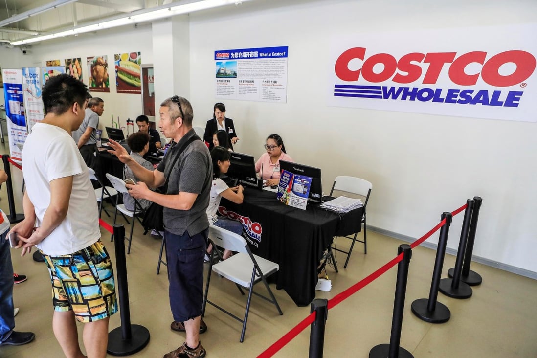 Shanghai residents sign up for membership of the country’s first Costco outlet. Photo: AFP