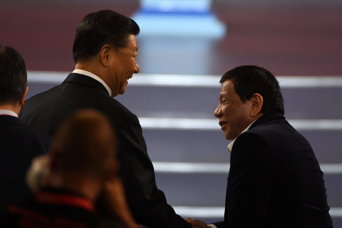 Xi Jinping (left) shakes hands with Rodrigo Duterte during the opening ceremony of the 2019 Basketball World Cup in Beijing on Friday. Duterte is on his fifth visit to China as president. Photo: AFP