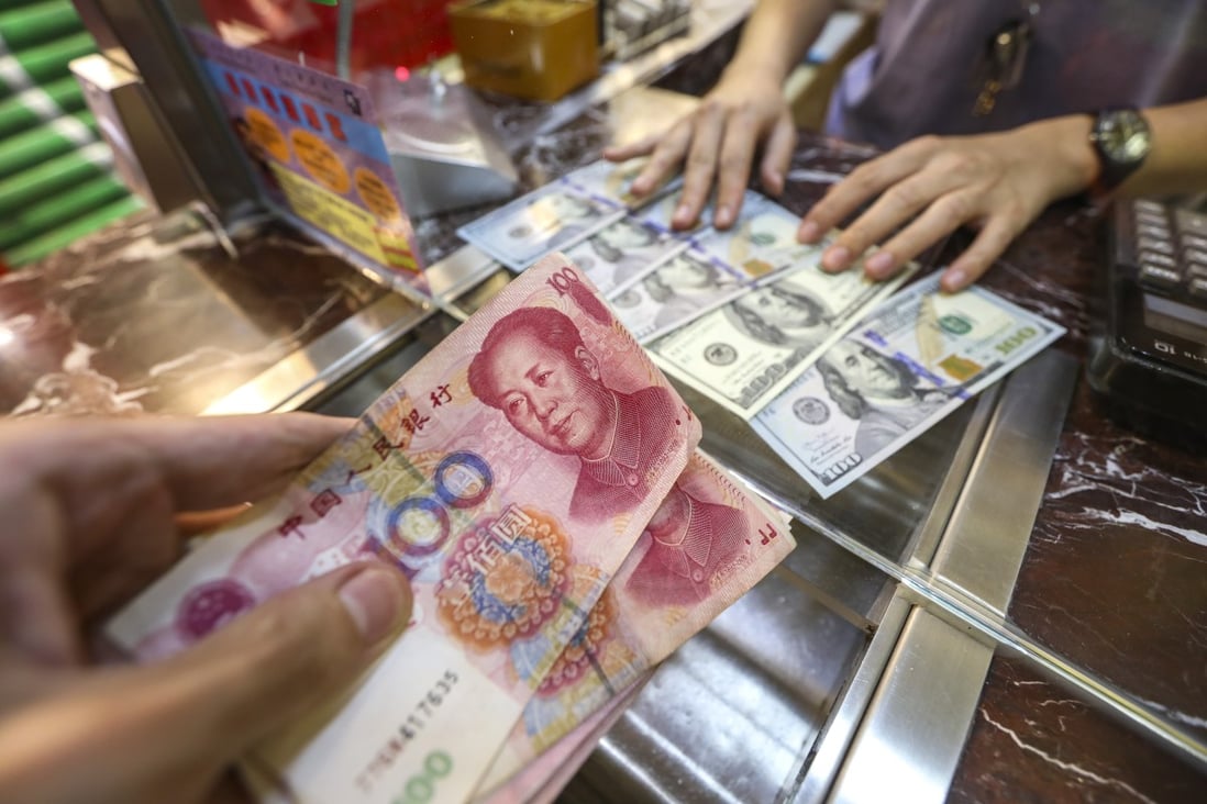 Many banks are adjusting their forecasts for the yuan in the light of its depreciation after more than a year of trade war with the US. Photo: Roy Issa