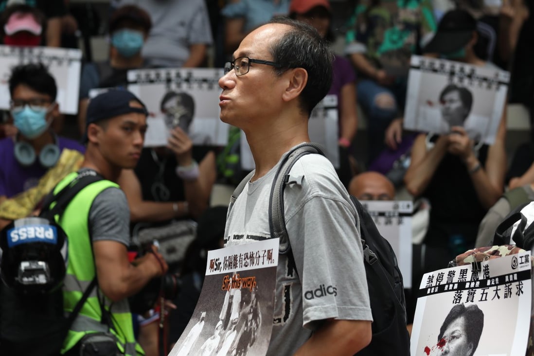 An unmasked protester on Hennessy Road in Wan Chai on Saturday. Protests went ahead despite a police ban. Photo: Xiaomei Chen