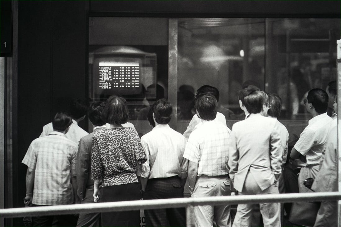 On May 22, 1989 Hong Kong stock prices suffered their heftiest one-day fall since the 1987 crash as waves of panic selling, prompted by the political crisis in China, swept through the local stock market. Pictured are anxious investors watching share prices plunge. Photo: SCMP