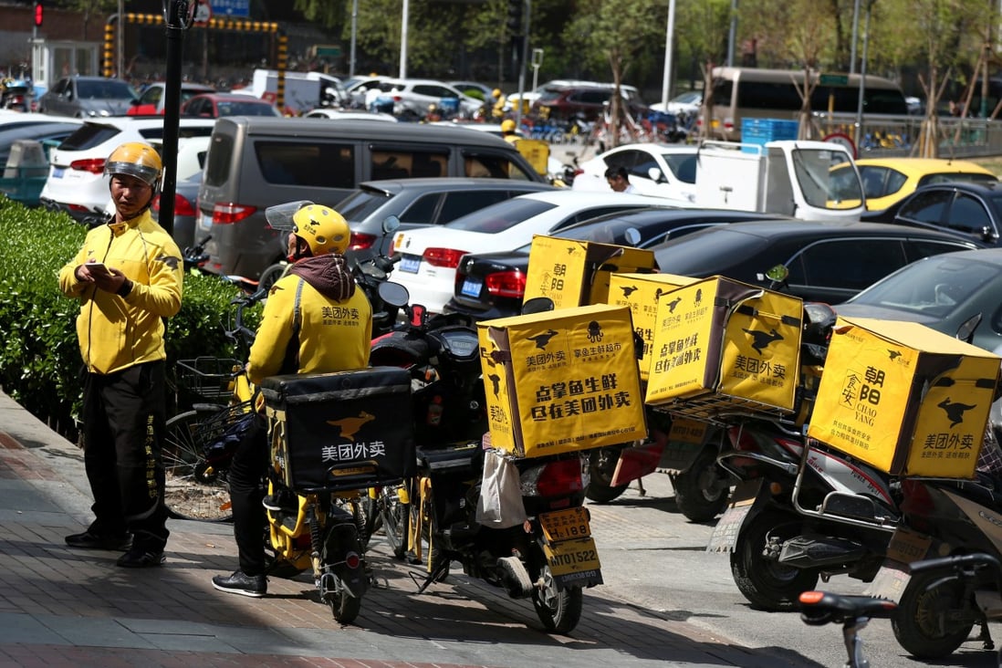 Drivers of food delivery service Meituan are seen in Beijing. Photo: Reuters