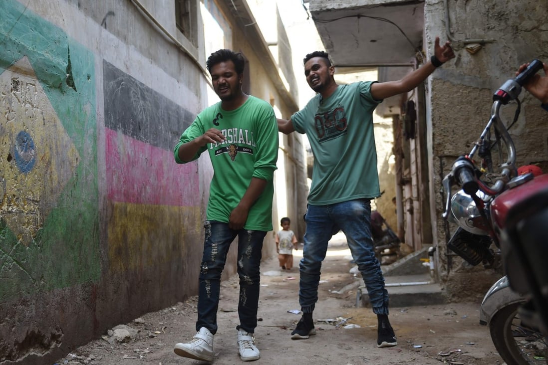 Rappers Mohammad Omar (right) and Wasim Masih perform in Lyari, one of Pakistan’s most dangerous neighbourhoods. Photo: AFP