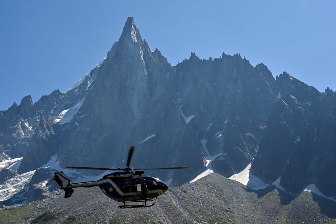 A helicopter flies over the Mont Blanc Massif - the mayor worries they will need a helicopter to remove a rowing machine left by a ‘wacko’ on Mont Blanc. Photo: Philippe Desmazes/AFP