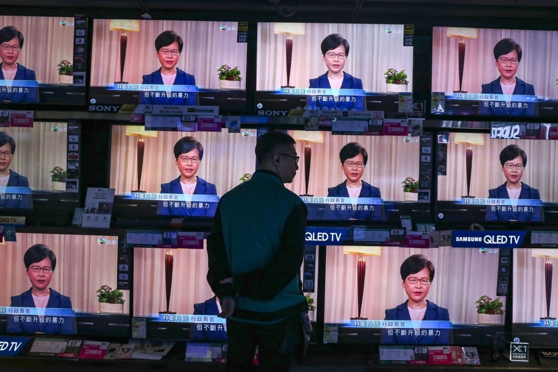 Carrie Lam announces the withdrawal of the bill in a dramatic U-turn, as Hongkongers watch the pre-recorded announcement on local television stations. Photo: Robert Ng