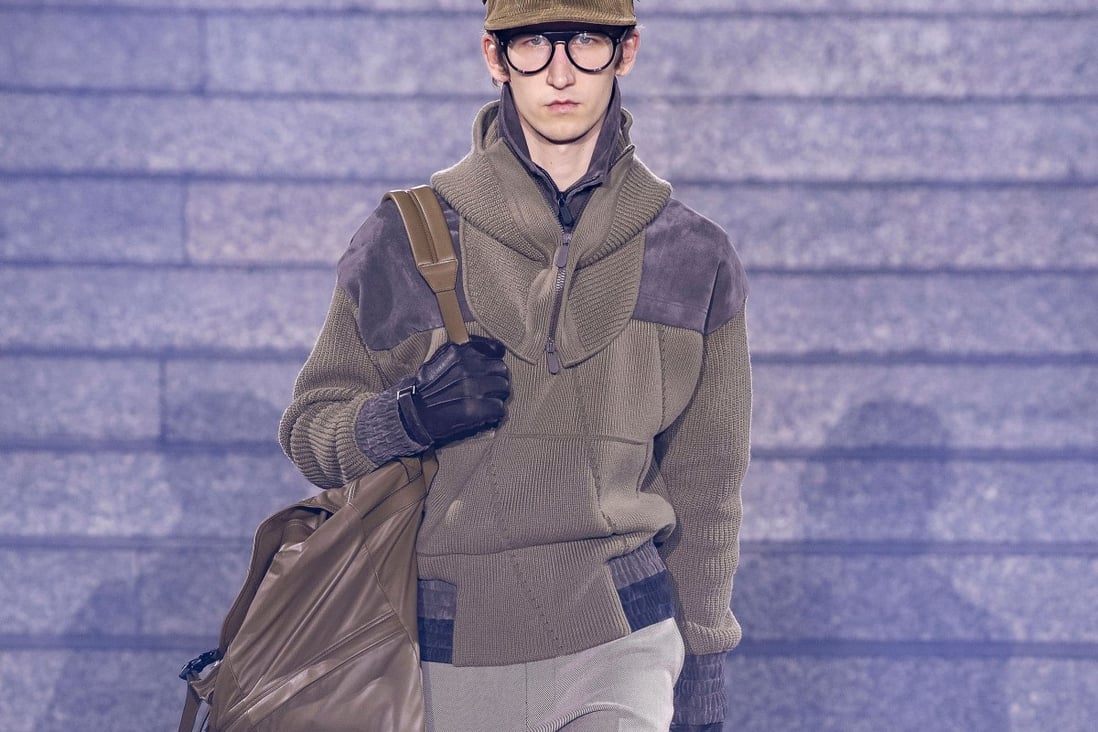 A model presents creations, including a voluminous holdall, from Ermenegildo Zegna’s fall/winter 2019 collection, which features designs made from fabrics that have been recycled from pre-existing sources and also made to be recyclable.
