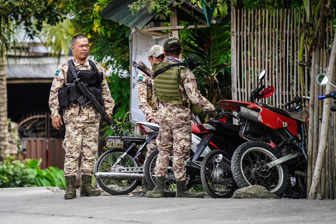 Moro Islamic Liberation Front rebels stand guard in Sultan Kudarat town on the southern Philippine island of Mindanao. Photo: AFP