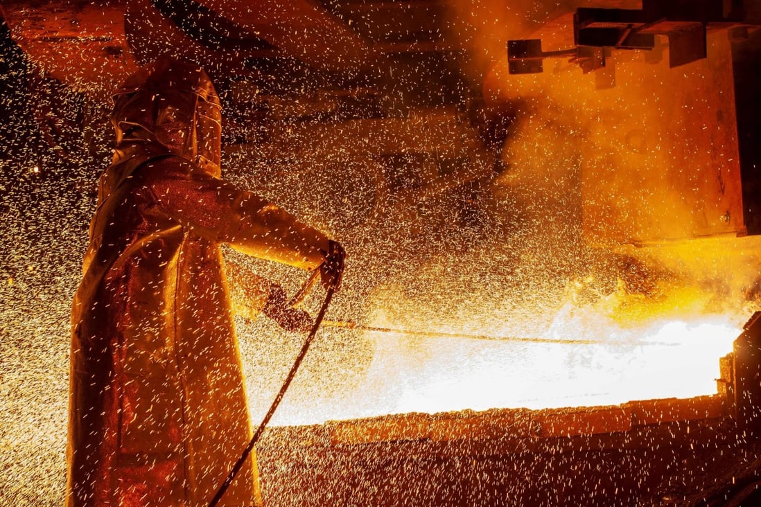 A worker mans a furnace on March 30, 2019, during the nickel smelting process at Indonesian mining company PT Vale's smelting plant in Soroako, South Sulawesi. Photo: Agence France-Presse