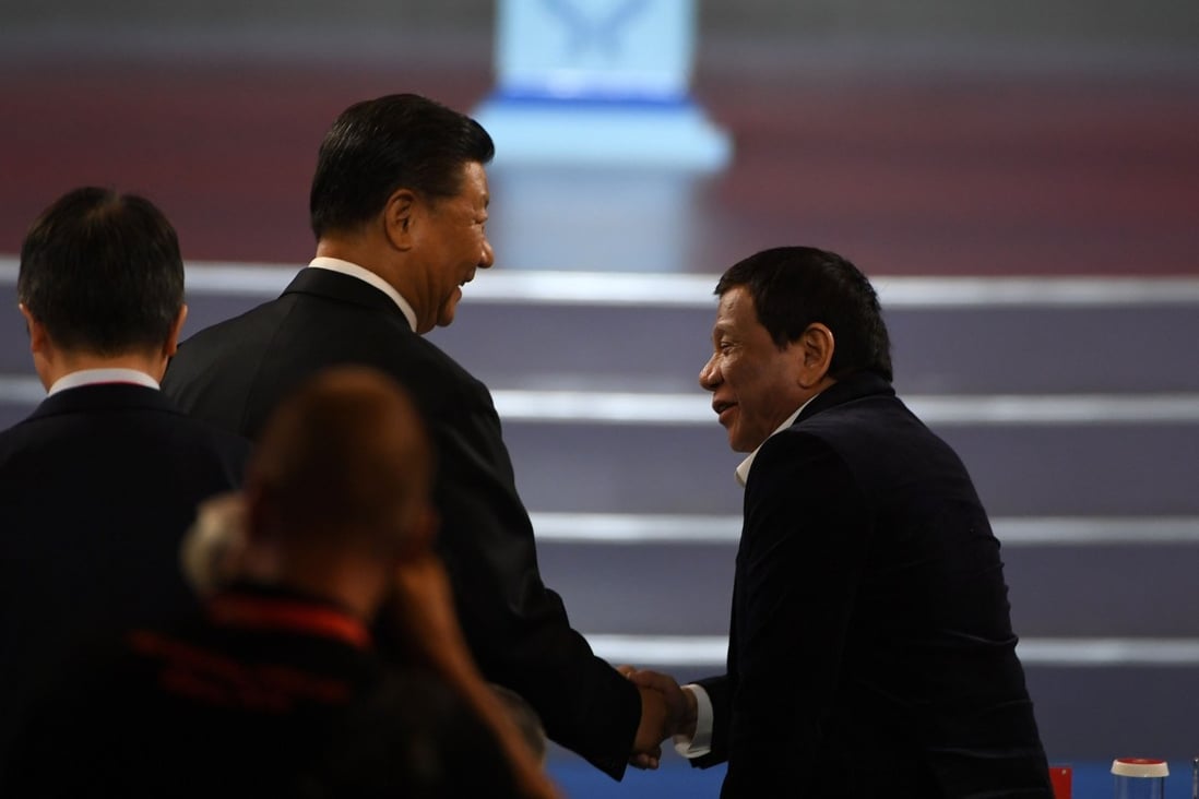 China's President Xi Jinping (left) shakes hands with Philippine President Rodrigo Duterte during the opening ceremony of the 2019 Basketball World Cup in Beijing on August 30. Photo: AFP