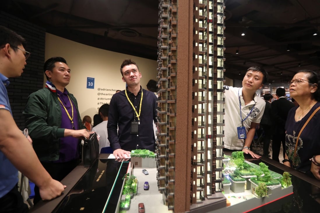 Potential buyers view a model of New World Development’s Atrium House, Tsuen Wan, in June. Ever-increasing property prices beyond the reach of most Hongkongers, while the government sits on a massive pile of reserves, have been a major cause of Hong Kong’s discontent. Photo: Xiaomei Chen