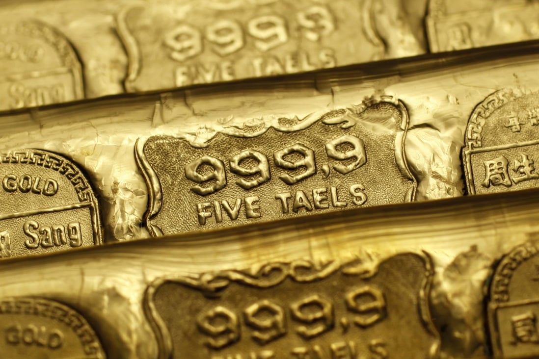 Five-tael (6.65 ounces or 190 grams) gold bars are seen at a jewellery store in Hong Kong. Gold prices have risen in recent months. Photo: Reuters