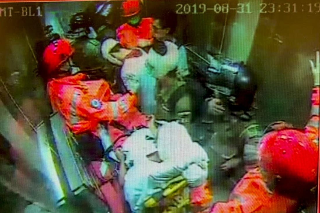 A screengrab of security footage shows paramedics escorting three of the injured out of Yau Ma Tei station. Photo: Handout