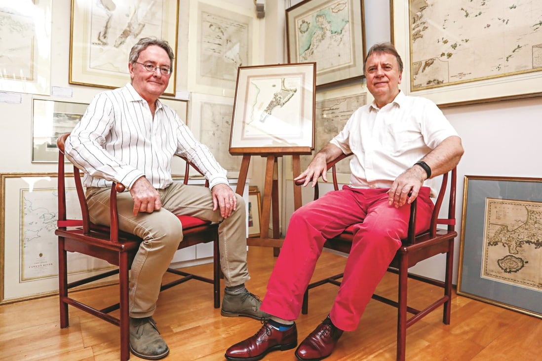Robert Nield (left) and Jonathan Wattis with a selection of historical maritime maps on show at Wattis Fine Art in Hong Kong’s Central district. Nield is selling much of his collection of maps and charts. Photo: Jonathan Wong